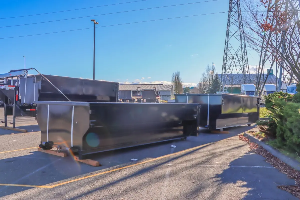 Roll-off dumpster ready for waste disposal at job site for 12 Yard Dumpster Rental in Athens